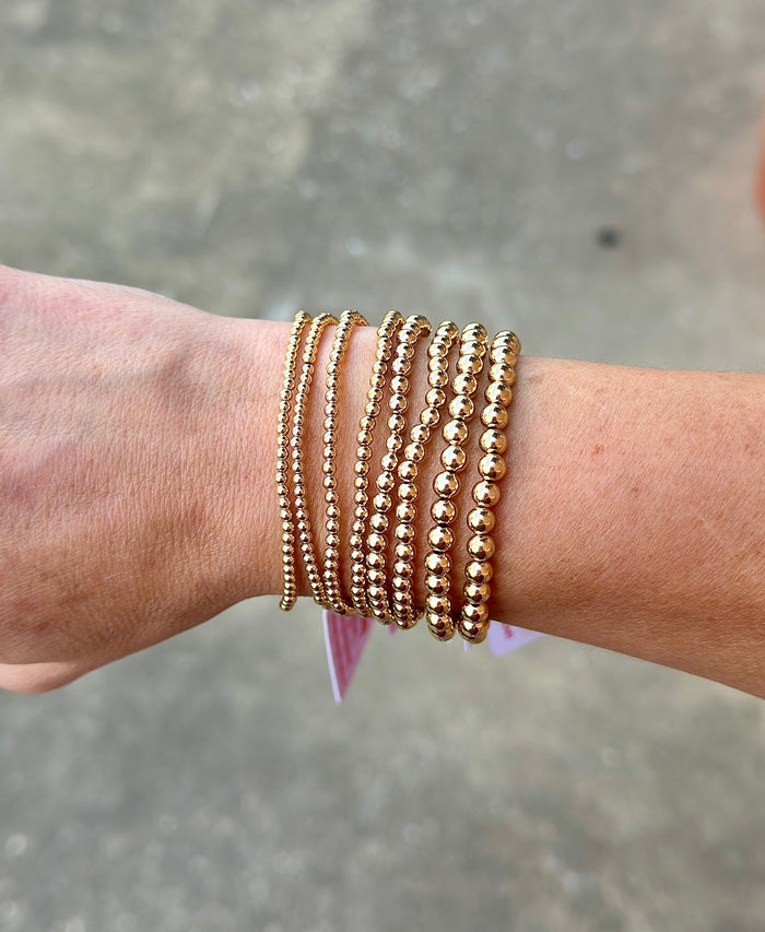Gold filled beaded bracelet stack featuring multiple bead sizes for everyday layering and stacking