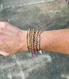 Emily 14k gold filled corrugated bead bracelet styled in a layered bracelet stack