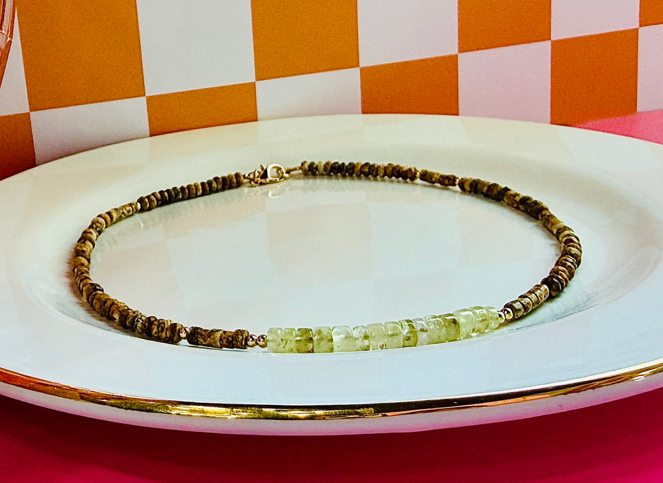 Stevie gemstone necklace featuring Prehnite and Picture Jasper beads on white jewelry display