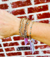 Emily gold filled corrugated bracelet worn in a layered gold bracelet stack
