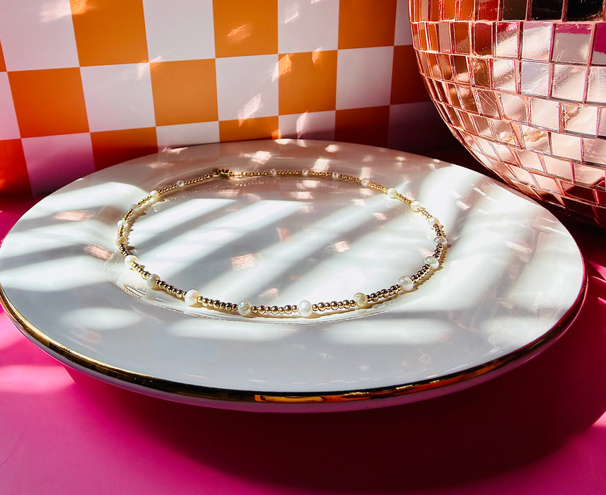 Gold filled Lyla Pearl Necklace with freshwater pearls displayed on white jewelry tray