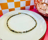 Close-up of Drew mother of pearl necklace with chocolate seed bead accents and gold lobster clasp