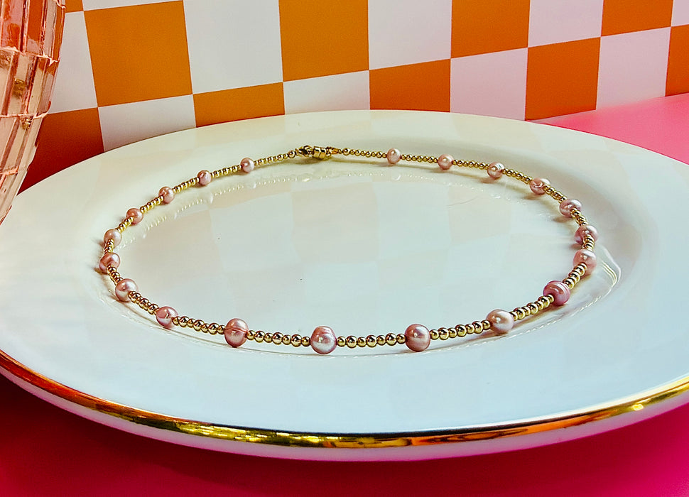 Lavender Pearl Necklace with freshwater pearls and gold filled beads on white jewelry tray
