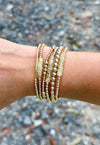 Stevie Prehnite and 14k gold-filled bracelet layered in a gold-filled bracelet stack