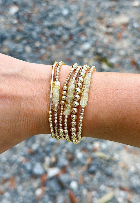 Stevie Prehnite and 14k gold-filled bracelet layered in a gold-filled bracelet stack
