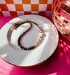 Picture jasper and freshwater pearl Sloane Necklace displayed on white tray with pink background